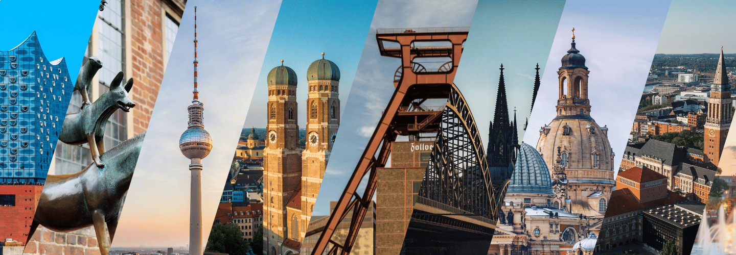 Foto mehrerer Karabinerhaken vor einer Felswand.